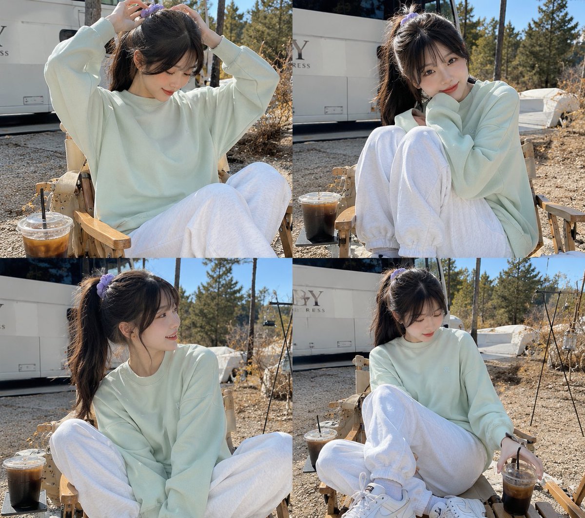 Young woman tying her hair in a sunny campsite portrait