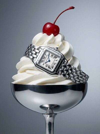 A diamond bracelet rests on whipped cream in a silver coupe