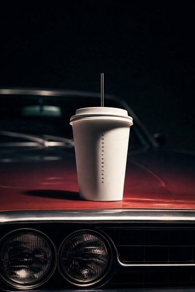 Cinematic Precision: Coffee Cup on Vintage Car Hood