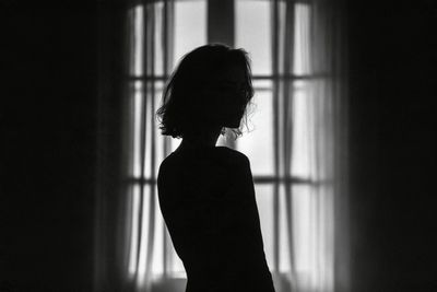 Ethereal Silhouette Emerges from Deep Shadows in Monochrome Reverie