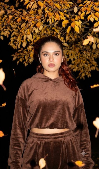 Autumn Night Magic Frames a Woman in Velvet Under a Yellow Tree