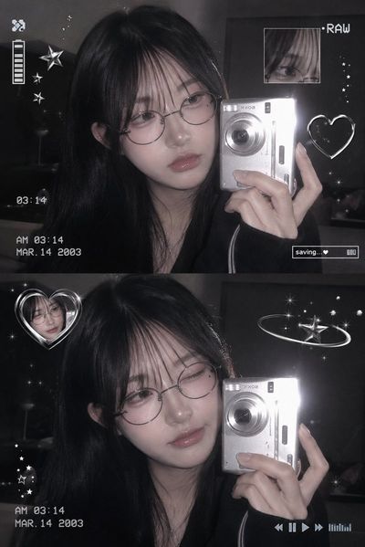 Korean girl in glasses takes mirror selfie with digicam