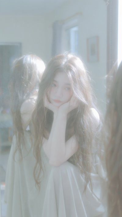 Melancholic Beauty in Soft Sunlight with Dreamy Film Texture
