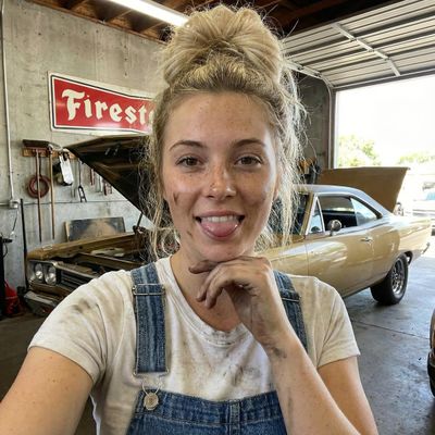 Cheeky Vibes in the Garage: A Playful Mechanic’s Portrait