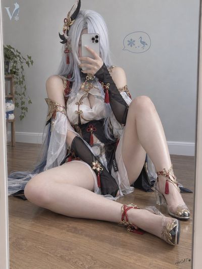 Young woman in cosplay takes mirror selfie in cozy room