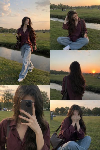 Woman in burgundy shirt walks by canal during golden hour