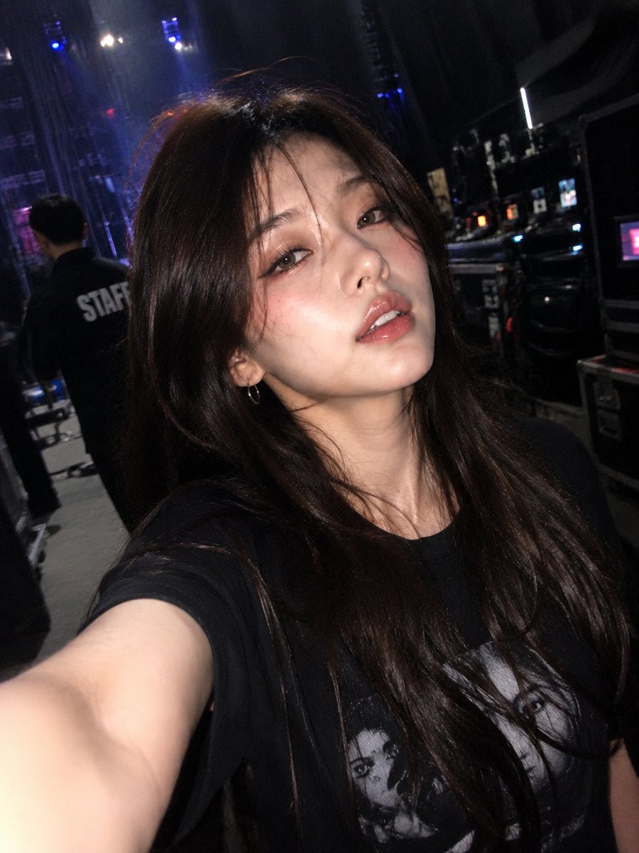 Singer captures a candid selfie while walking backstage after concert