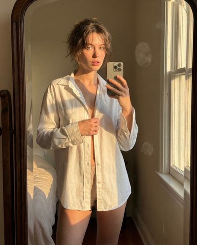Golden Hour Reflection: Intimate Mirror Selfie in Soft Light