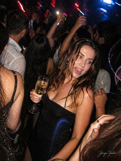 Candid Laughter Amidst Nightclub Chaos