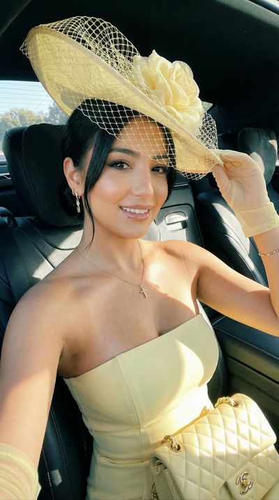 Chic Elegance: Luxury Car Selfie in Soft Yellow
