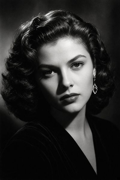 Captivating 1940s Starlet Poses in Dramatic Black-and-White Studio Portrait