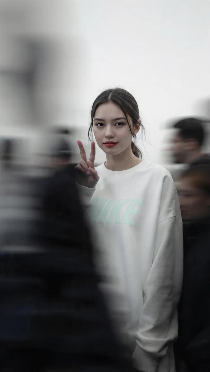 Poised Stillness Amid Urban Motion in High-Fashion Portrait