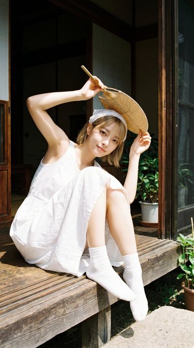 Summer Portrait of a Young Woman on a Veranda