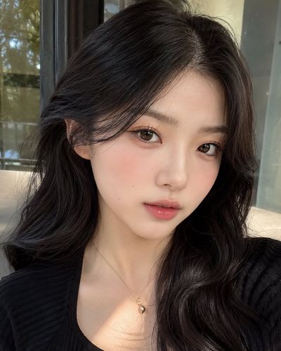 Soft peach blush and taupe shadows define Korean clean girl makeup