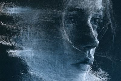 Subject Haunted by Smudged Chalk Ghosts on Dark Slate