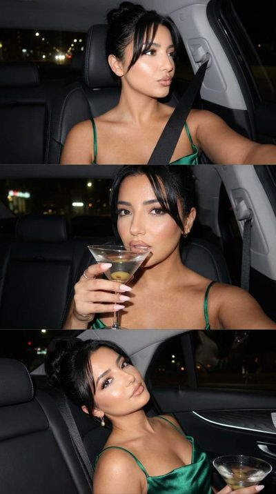 Emerald satin dress shines in night car selfie flash
