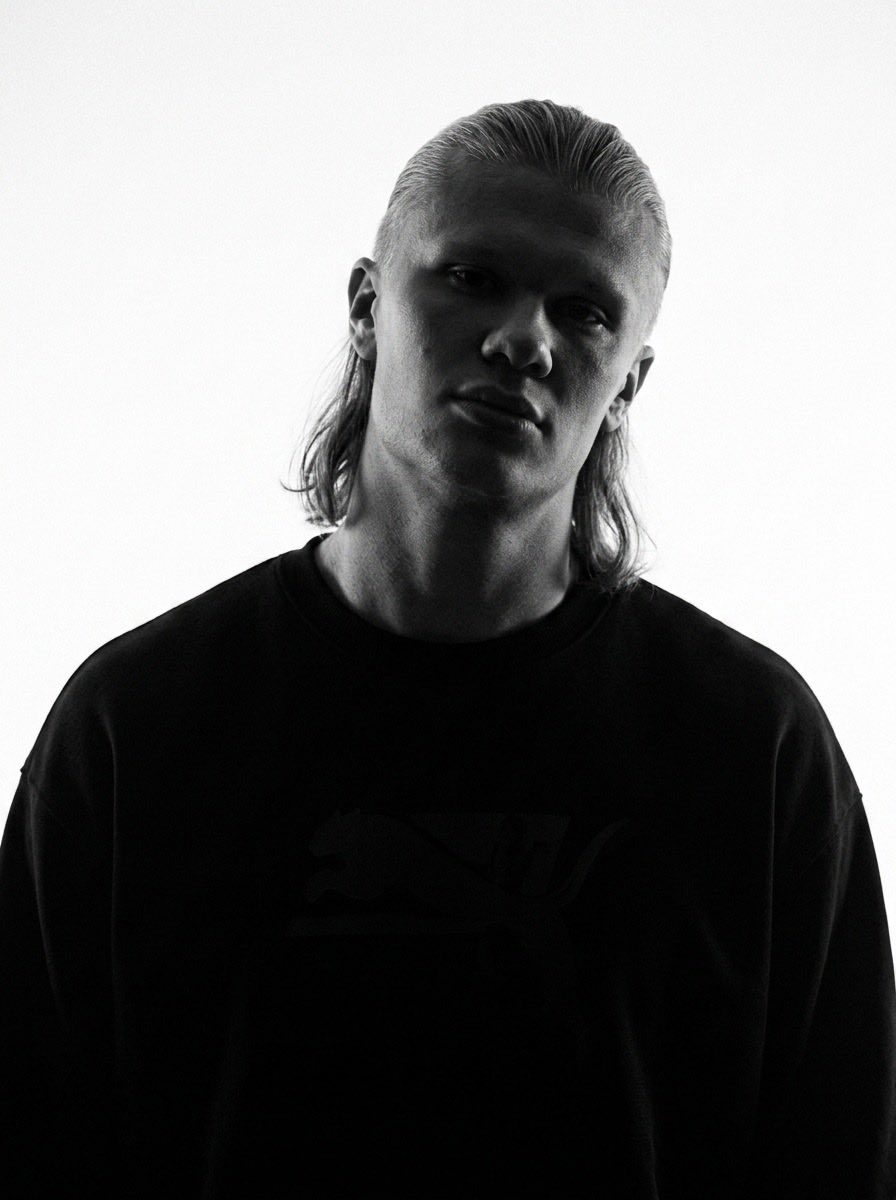 Stark monochrome portrait captures intense editorial mood in low-key lighting