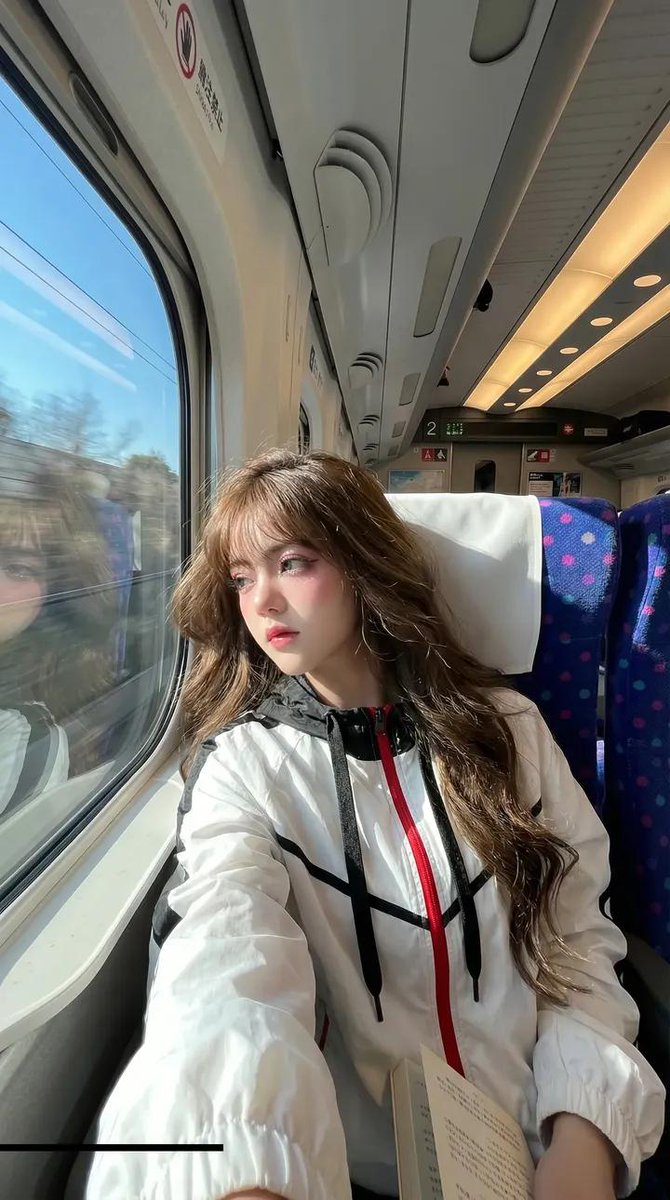 Windblown Train Ride: A Handsome Traveler's Candid Selfie
