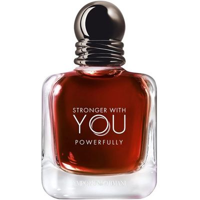 A crystal perfume bottle glows amid warm candlelight and romance