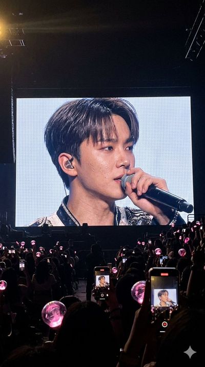 Passionate singer performs on massive Jumbotron screen for excited crowd