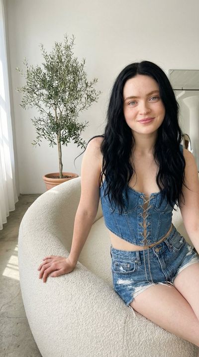 Confident Smile with Sadie Sink’s Face and Dark Wavy Hair
