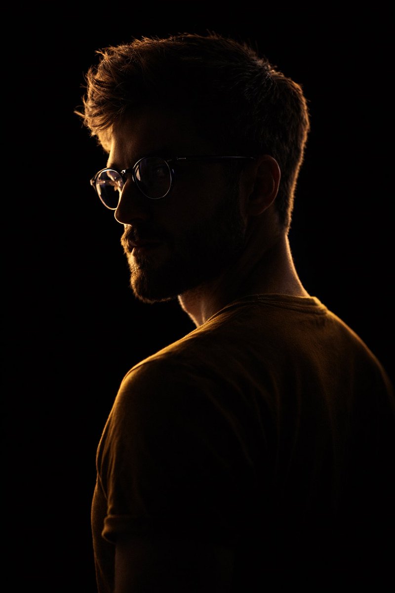 Cinematic Low-Key Portrait of a Bearded Man in 64K Ultra-High Resolution
