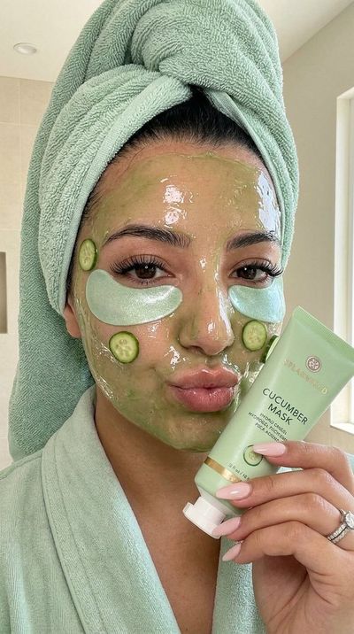 Fresh cucumber mask glows on glowing skin in soft spa light