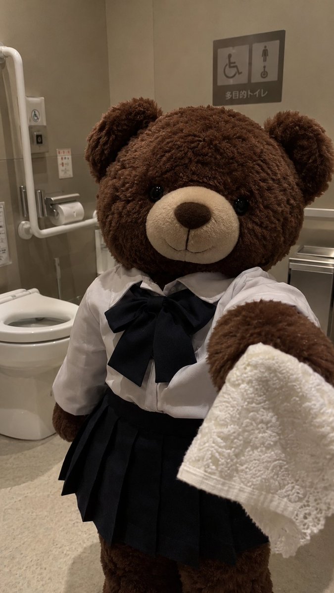 Woman in Seifuku Holds White Lace in Accessible Restroom