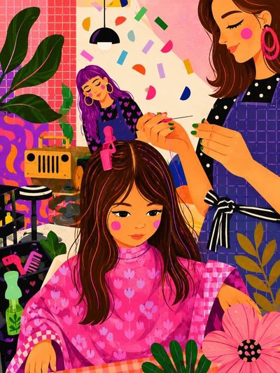 Stylist braids long brown hair in cozy pink salon
