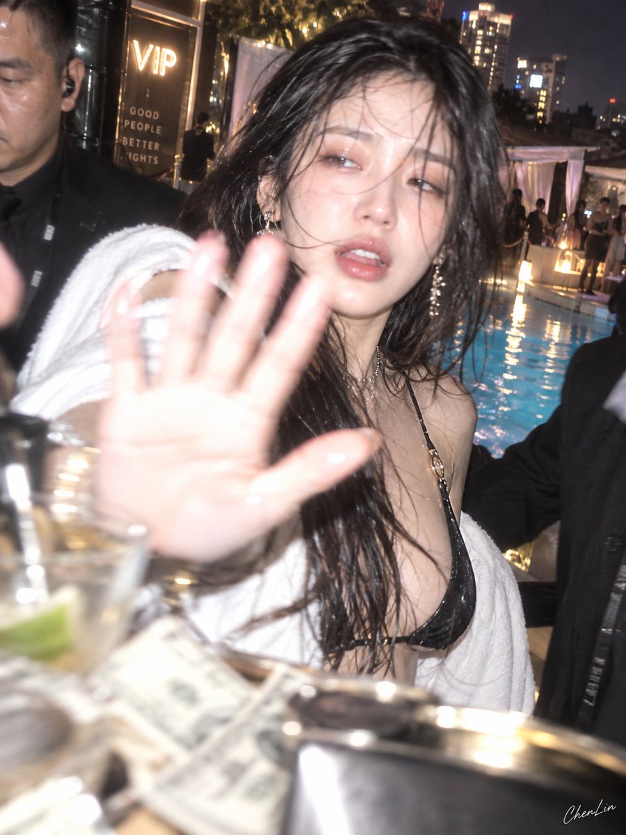 Glamorous Party Girl Raises Hand to Block Paparazzi Flash