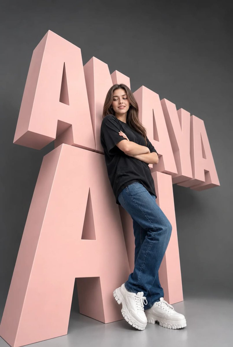 A model leans relaxed against a massive pastel pink typography sculpture