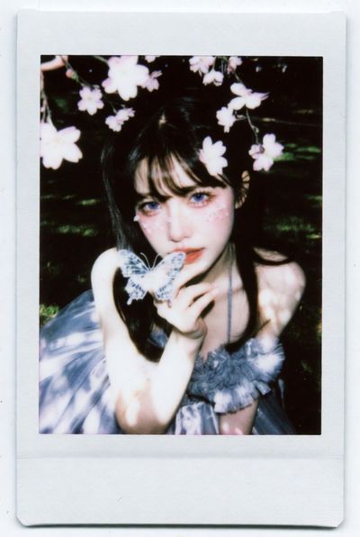 Enigmatic Portrait of a Blue-Eyed Beauty in Retro Haze