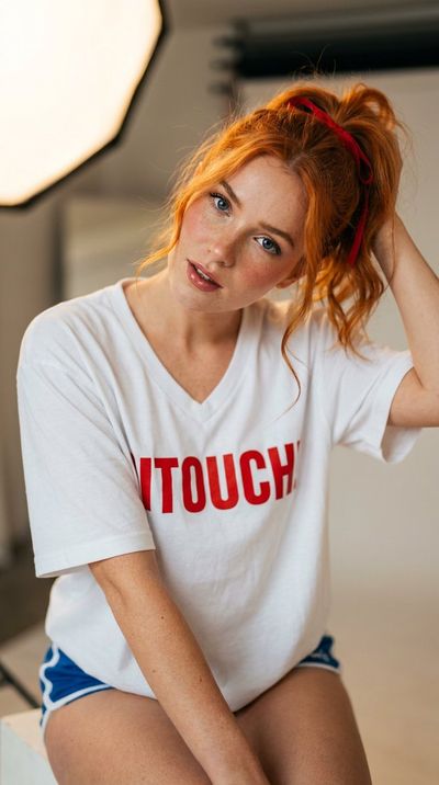Seductive Portrait of Young Woman in Oversized T-Shirt