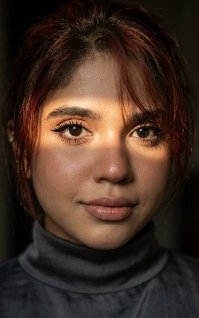 Close-up portrait of a woman's face in warm directional light
