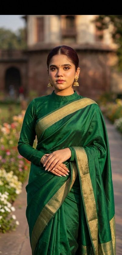 A young Indian girl in golden light gazes at the camera