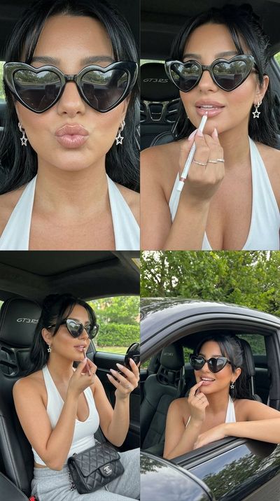 A glamorous woman poses in a Porsche 911 GT3 RS