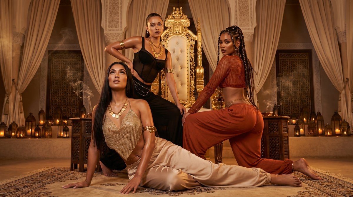 Three fashion muses command a golden throne in a Marrakesh riad.