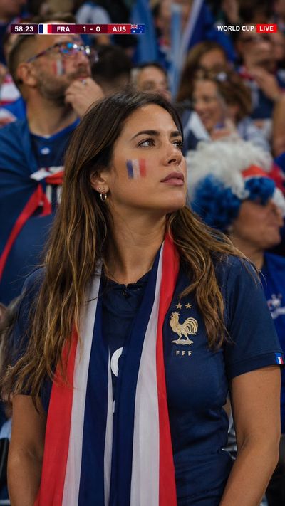 French fan watches intently from packed World Cup stadium stands