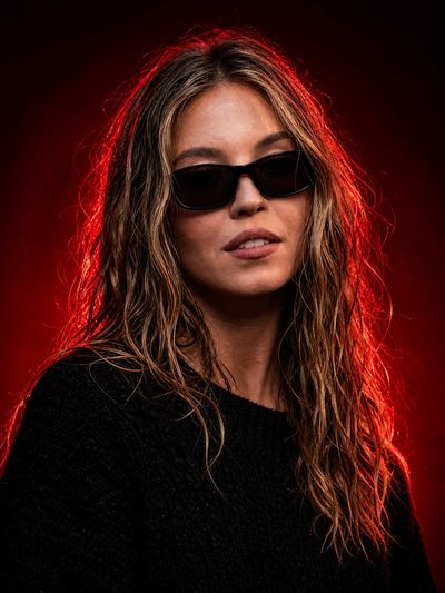 Cinematic Studio Portrait: A Luxurious Red-Light Aesthetic