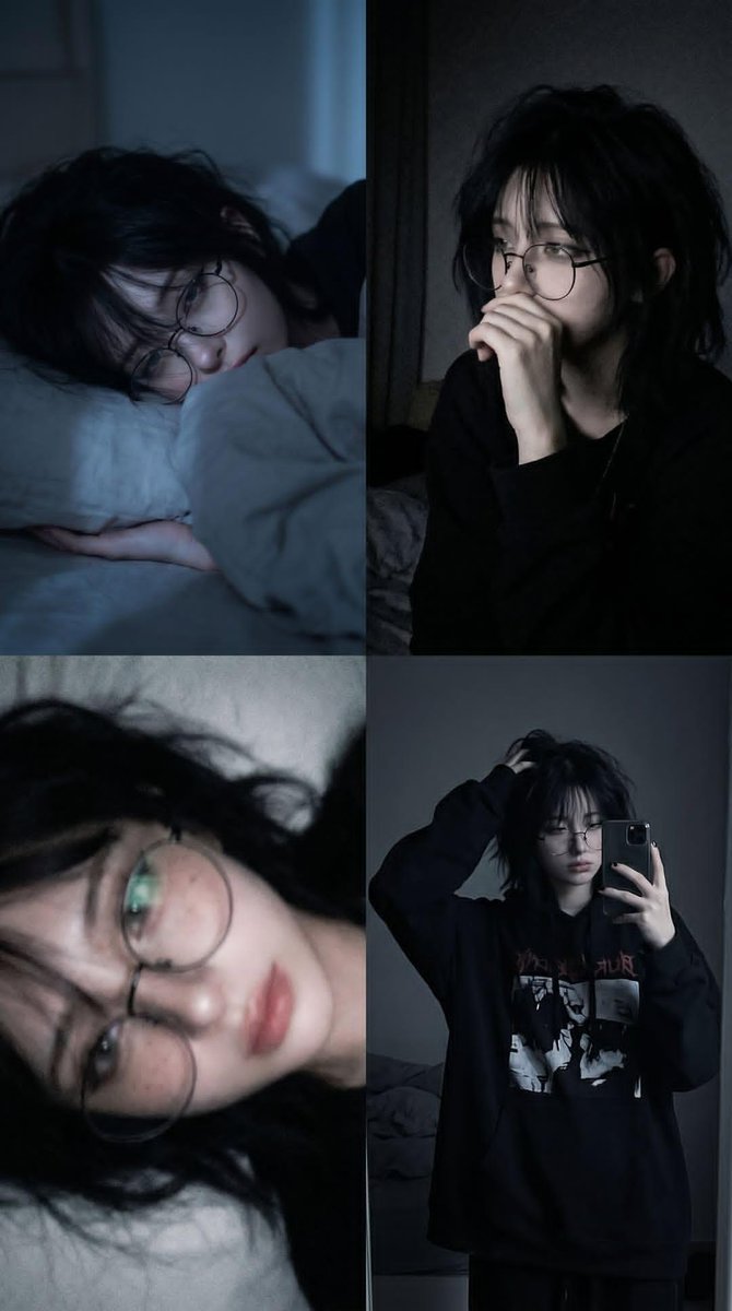 A tired young person lies on a pillow in blue moonlight