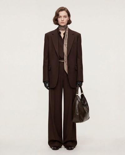 Minimalist Elegance: Tall Model in Tailored Brown Suit and Silk Scarf