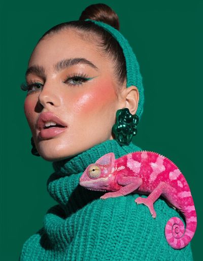 Bold Contrast: Green Outfits Meet Vibrant Pink Chameleon