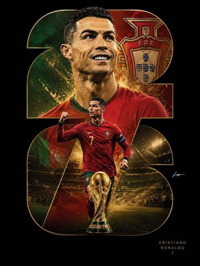 Soccer star smiles in red jersey with golden trophy below