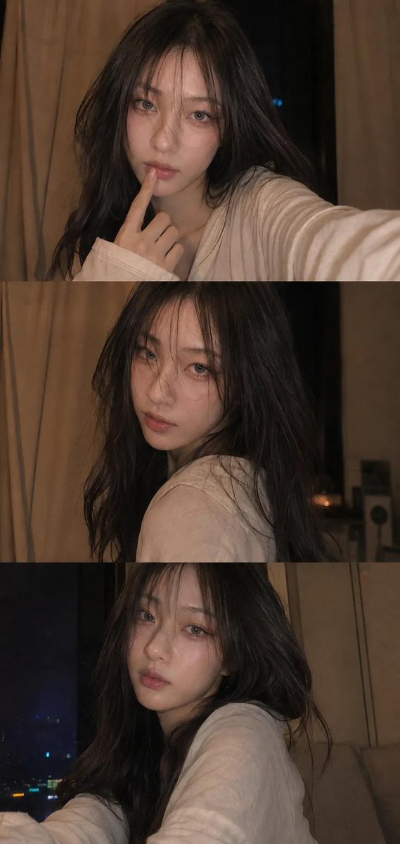 Woman in candid selfie with finger to her lips at night
