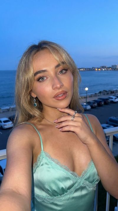 Sabrina Carpenter in Mint Evening Elegance
