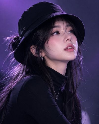 Korean model in black bucket hat stares upward with mysterious confidence