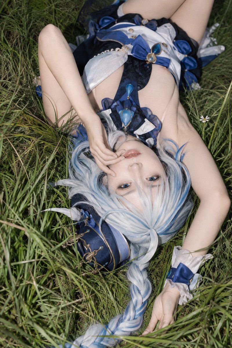 Person Lies in Tall Grass Under Harsh Direct Flash Light