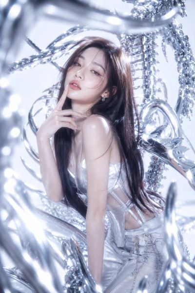 A K-pop idol in neo-futuristic Y2K style poses elegantly with chrome