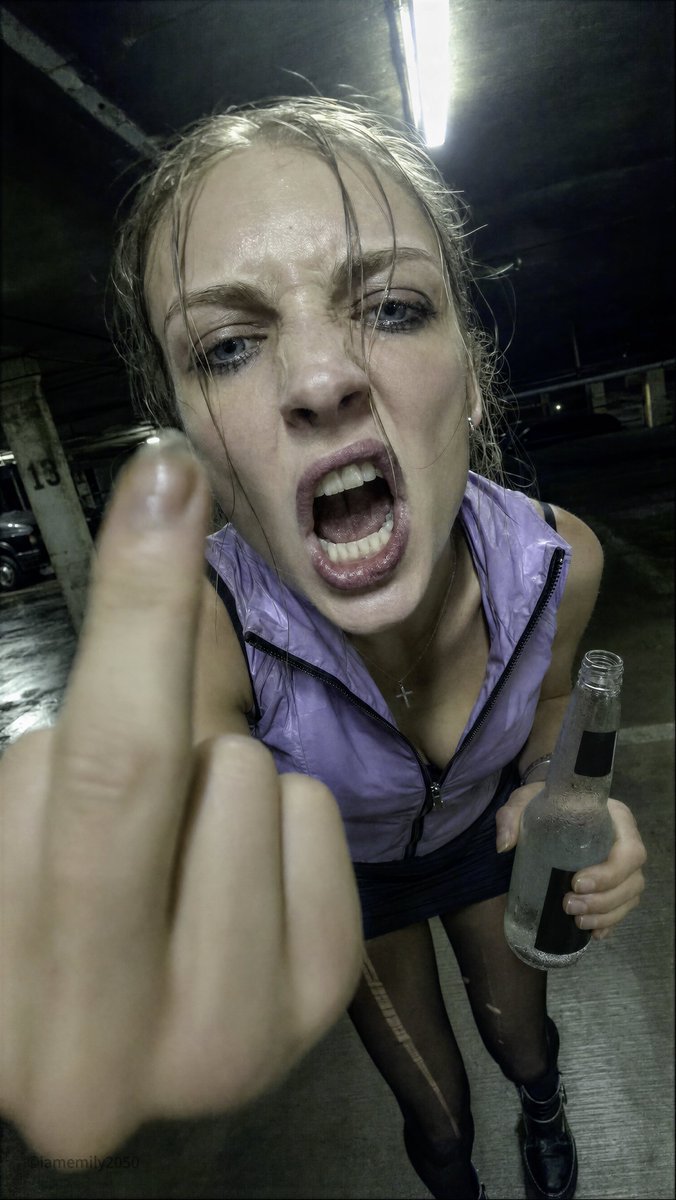 Woman's furious shout distorted by ultra-wide lens in green light