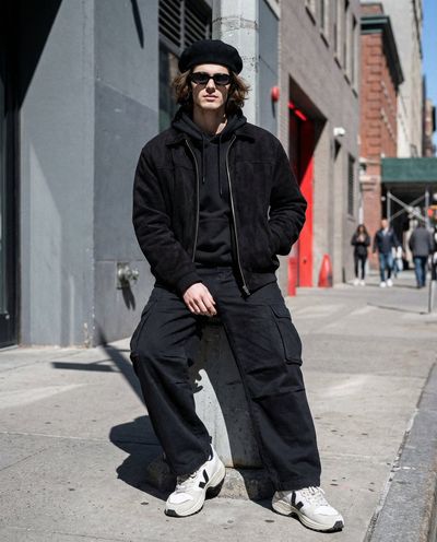 Urban Androgyny: Sharp Midday Portrait in Monochrome Layers